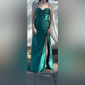 Beautiful satin green dress from Lily’s Bridal Boutique.